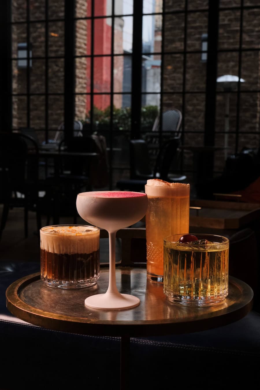 Assorted cocktails served at Rosevale lounge with window backdrop